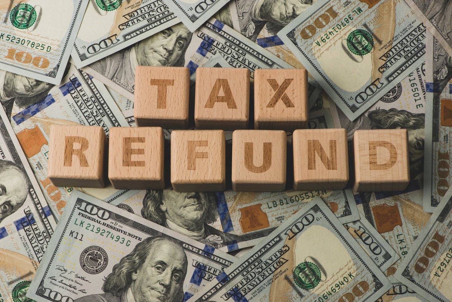 Tax Refund concepts. Tax Refund characters and US currency notes. Tax Return.